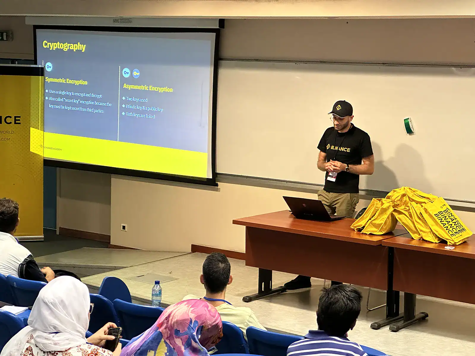 Blockchain Sam teaching a cryptography session to students